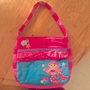 A toddler bag that have so many fun colers it is stephen Joseph.